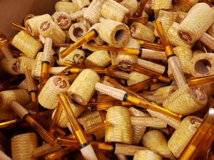 A barrel of corncob pipes, ready for packaging and shipping to their new homes