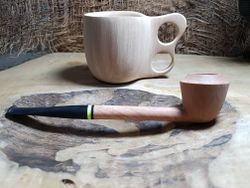 A cup and a pipe