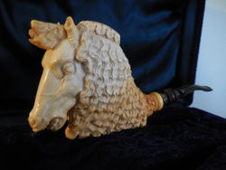 This horse is signed and dated 1999, and with a full presentation case, plaque, matching carved tamper, but no papers. Sabri did a long series of unicorns that look exactly like this horse but have a single, spiral, and threaded-to-unscrew-and -store-for safekeeping horn of black water buffalo. It weighs in at a hefty 148 grams.