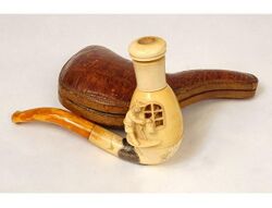 This is the most frequently encountered 19th-century meerschaum cheroot holder motif modelled as a watchman with a lantern; the revolving exterior reveals erotic scenes through the windows. Courtesy, antiques-delaval.com